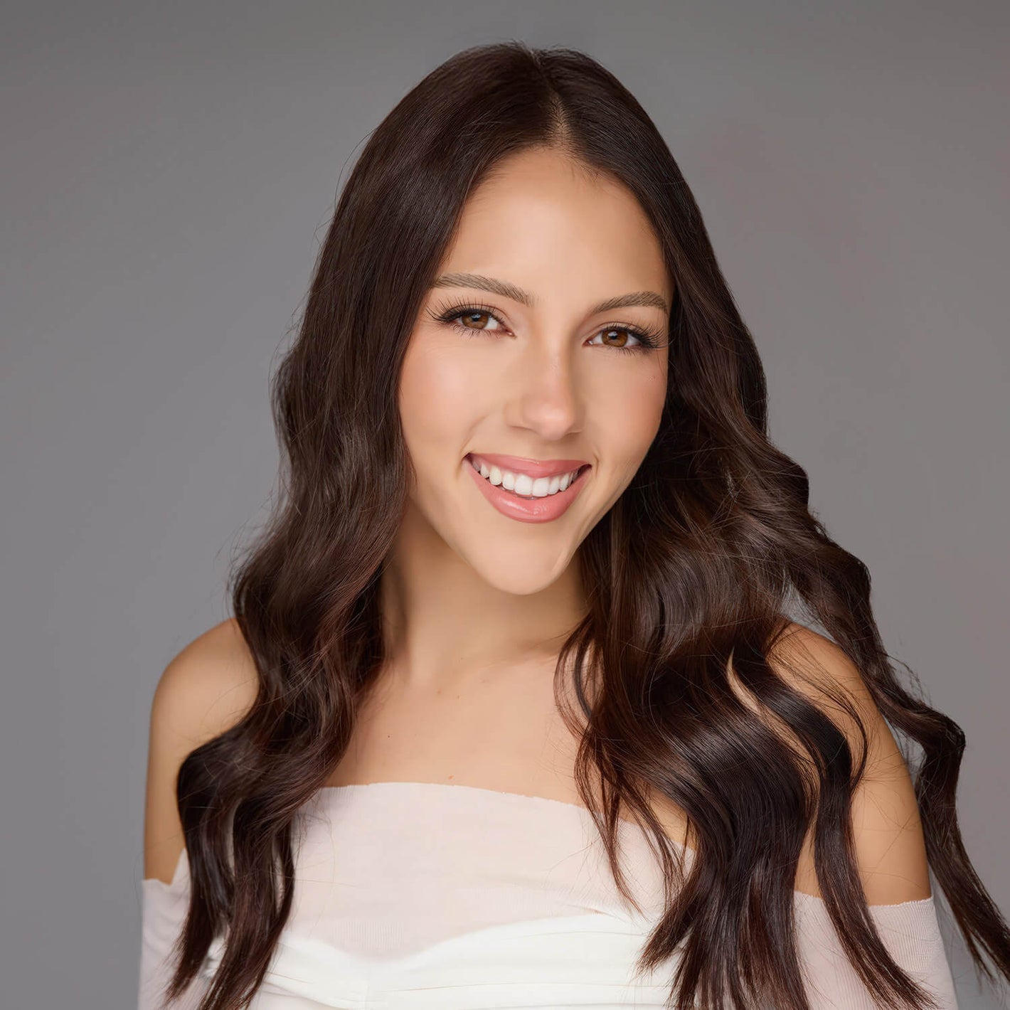 Amira Mollenhauer Aussie Dance Tour 2026 Choreographer with long, wavy hair smiling against a gray background